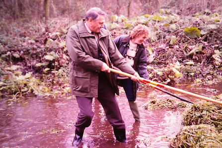 Sir David Attenborough with Lynn Trevis raking Watercress at Lemsford Springs in 1985